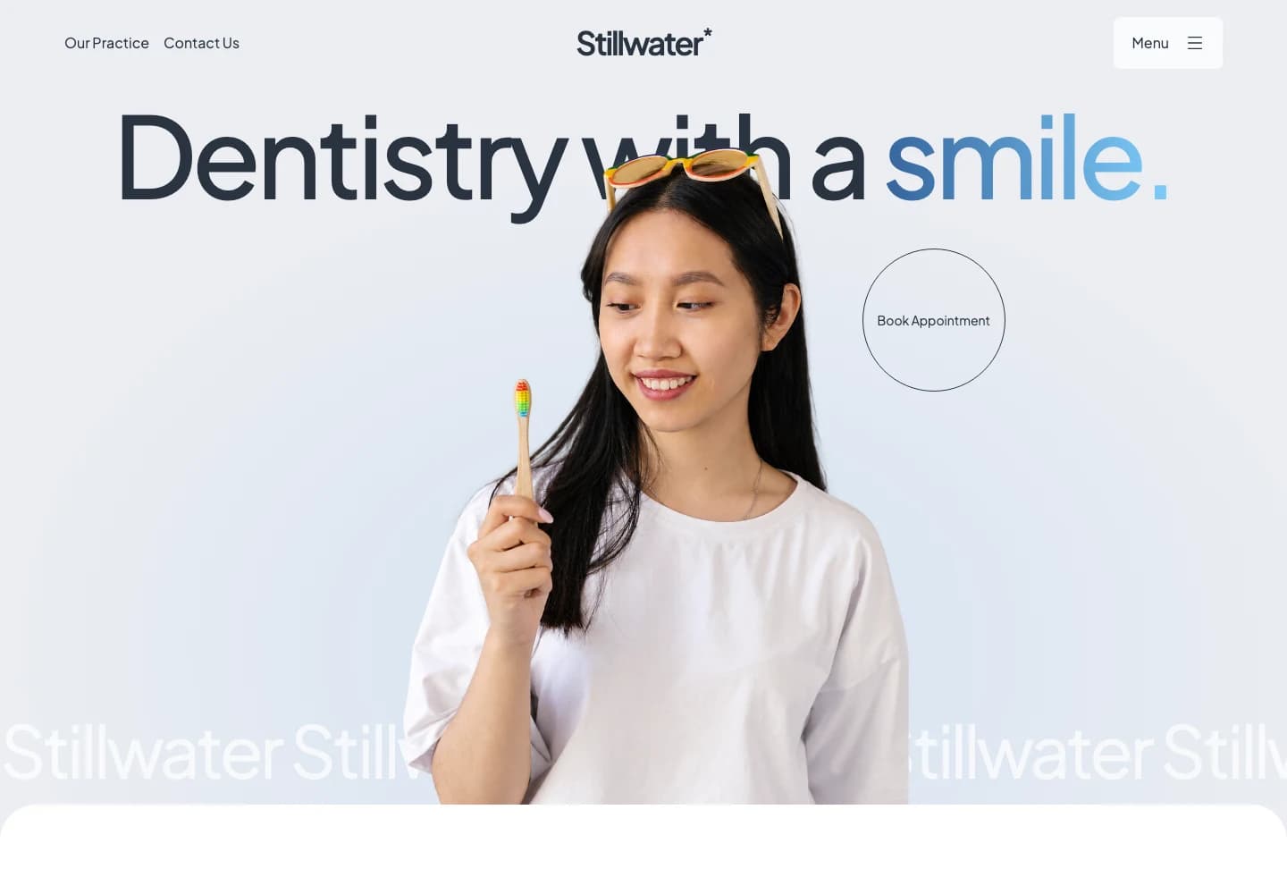 Stillwater Dental website with oversized charcoal typography, a blue gradient and a smiling woman holding a toothbrush
