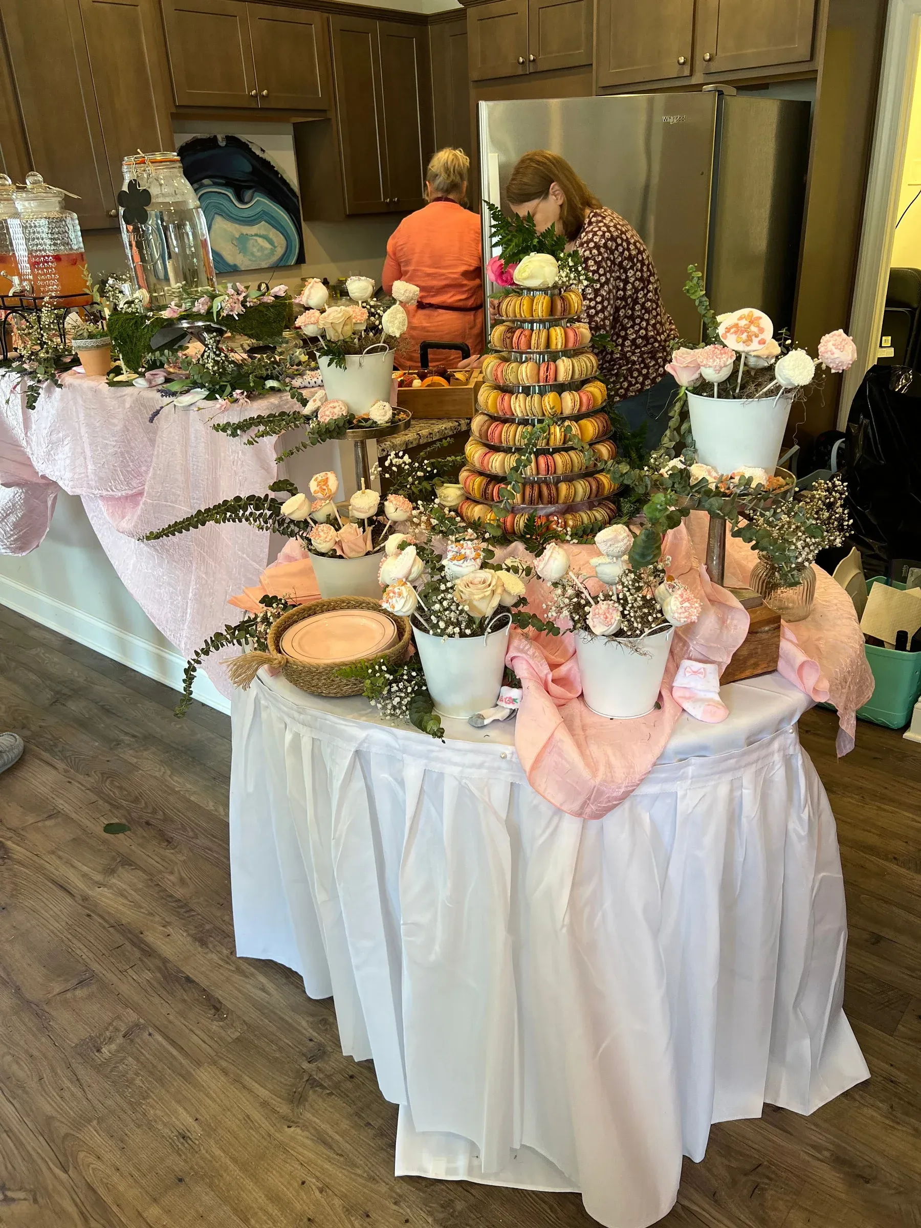Celebration dessert display with white table skirts