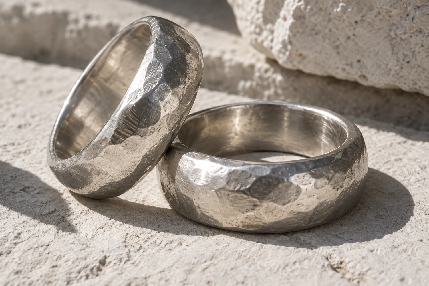 Silver-tone ring material study with soft edges and visible tool marks