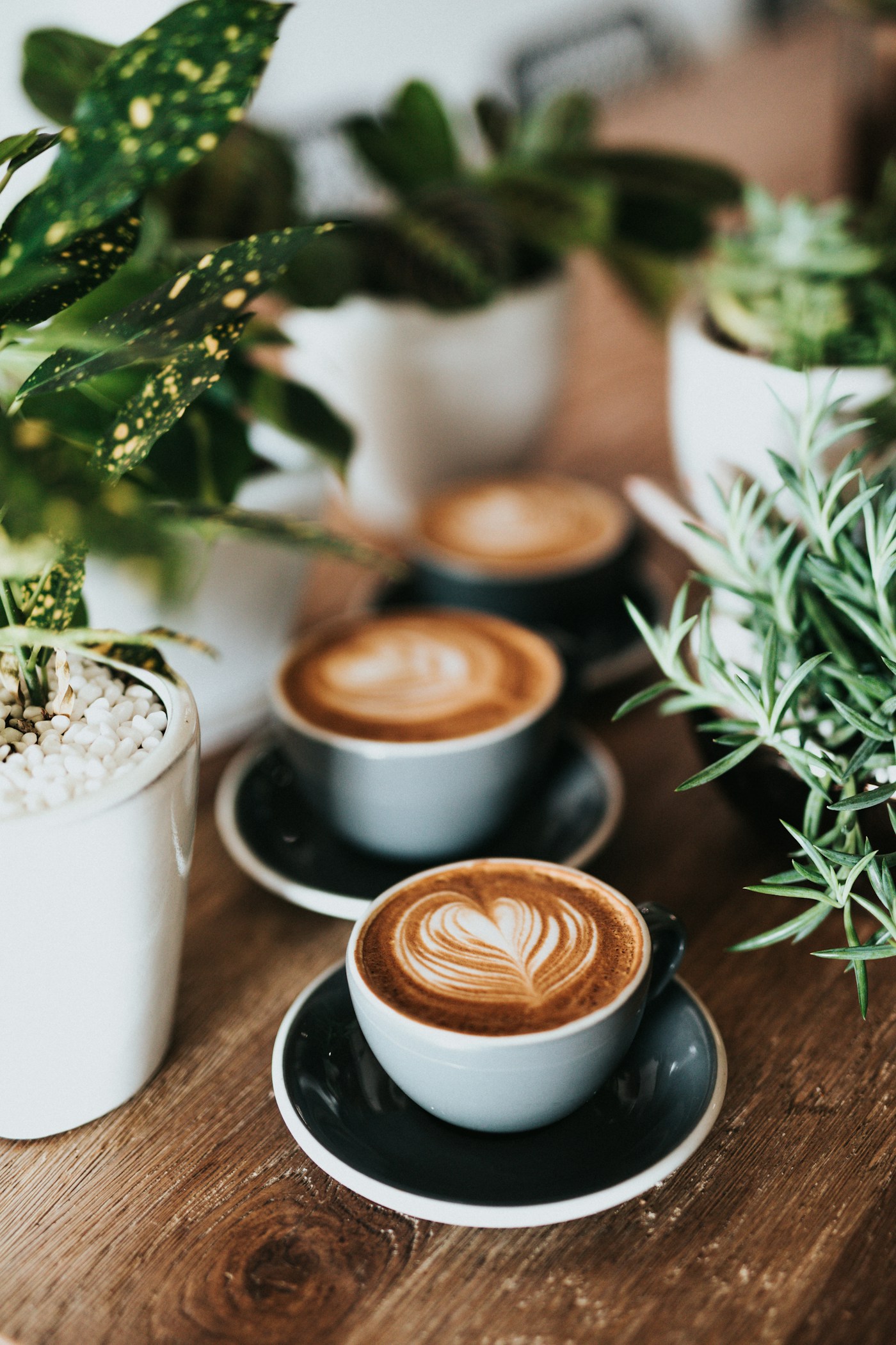 Heart-shaped latte art in a ceramic coffee cup