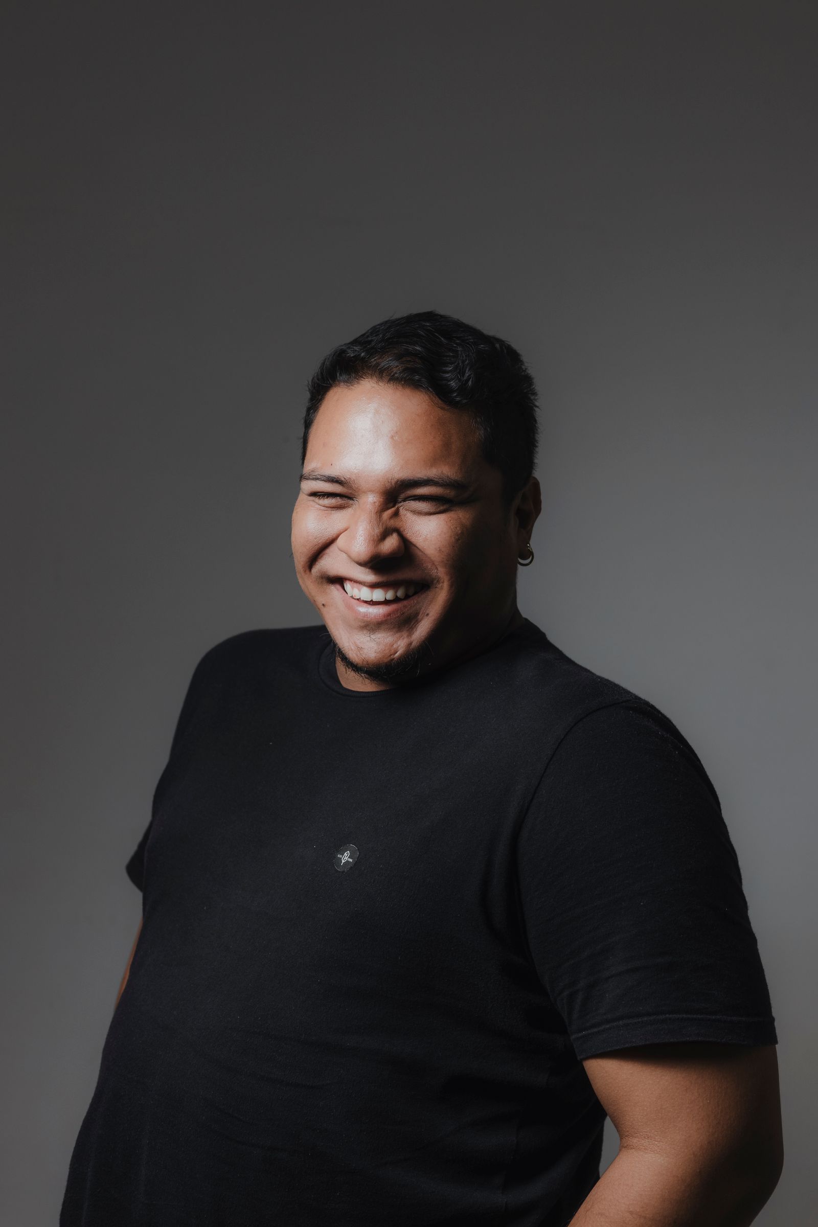 A man with a relaxed, happy smile